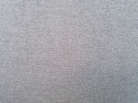 Textile texture background up close with gray and light colorsの写真素材