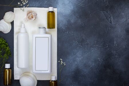 Cosmetics SPA branding mock-up, top view, on dark blue background, place your designの写真素材