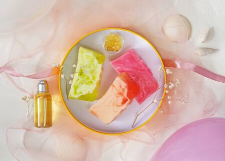 Three pieces of homemade organic natural soap in a gift round boxの写真素材