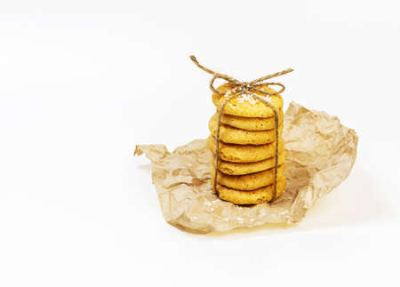 Homemade organic coconut cookies on white background. Sweet pastries with coconut flour are gluten-free, low in carb. Keto diet. Sweet present. Healthy and tasty dessert. Eco-friendly food packagingの写真素材