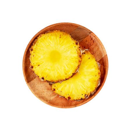 The concept of a healthy breakfast for weight loss and taking care of the figure. Pineapple diet for fat burning. Pineapple on a wooden plate with cup of coffee and measuring tape. Square orientationの写真素材