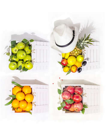 Vertical composition with ripe, seasonal, organic fruit in white boxes on a white background with copy space. Healthy season foods. Local market, farm fruits. Harvest Day Celebration. Summer saleの写真素材