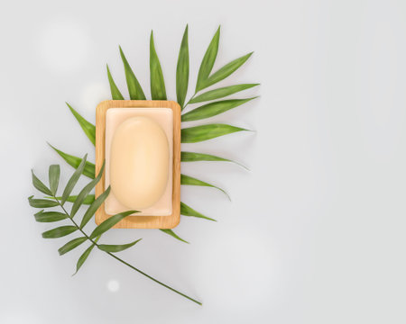 Bars of natural soap or dry shampoo on a wooden stand with palm leaves on a blue background with...