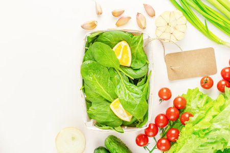 Vegan healthy food composition with local, farm vegetables in eco friendly packaging with label on a...