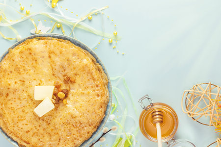 Fried crepes, jar with honey and decoration