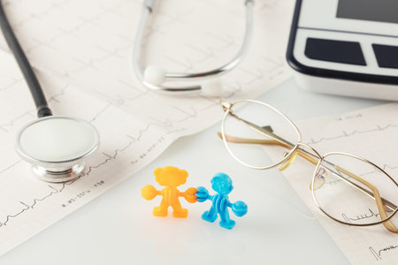 Family healthcare, medicine and insurance concept. Family figures, cardiograms, tonometer,...