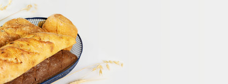 Eco friendly, food banner with fresh three loaf of bread in the blue basket on a white background...