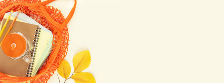 Back to school Banner. Eco friendly, school sale concept. School supplies in a bright yellow textile...