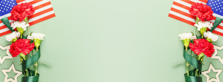 American holiday banner with bouquet of carnations and American flag on green background with copy space suitable for Memorial Day, 4th of July, Labor Day, Independence Day, Veterans day. banner sizeの写真素材