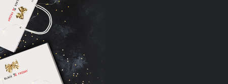 Banner of Black Friday event. Gift white box and bag with inscription Black Friday with holiday decor on black texture background with space for text. Black Friday sale banner. Flat lay, banner sizeの写真素材