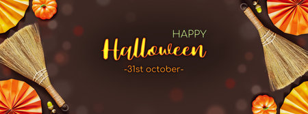 Halloween holiday banner. Autumn composition with halloween decorations on a brown background with bokeh effect and congratulation inscription. Halloween background. Flat lay, banner sizeの写真素材