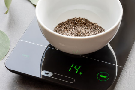 Super food, Chia seeds in a glass bowl on a kitchen scaleの写真素材