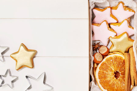 Gifts box with home made cookies, dry fruits, nuts and cinnamon stiksの写真素材
