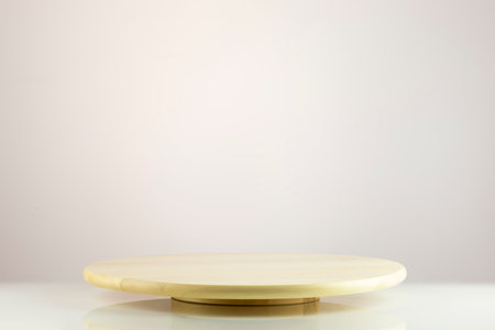 Empty wooden podium on a light gradient background with copy space. Natural product display for presentation. Beautiful showcase from natural materials for new products and promotion saleの写真素材