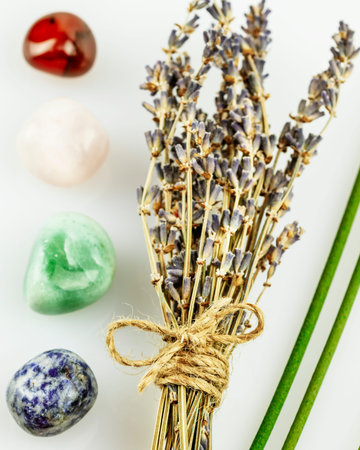 Recovering, energy healing composition with lavender flowers, aroma sticks and chakra stones on...