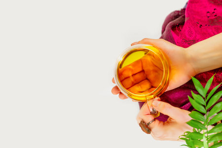 Woman relaxing and meditation with cup of healing herbal teaの写真素材