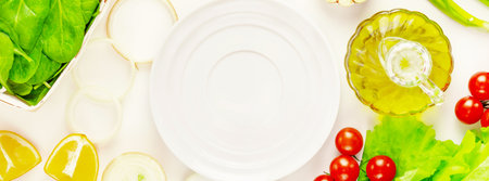 Healthy food banner with organic farm vegetables, olive oil and empty white plate on a white background. The concept of vegan healthy mindful eating, diet and detox. Ingredients for vegetables saladの写真素材