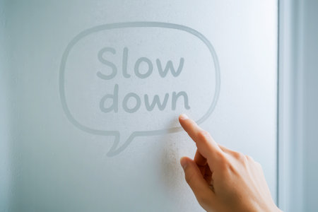 Finger Drawing âSlow Downâ On Foggy Glass Window In Soft Lightの写真素材