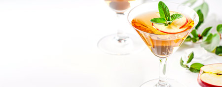 Apple Martini In Elegant Cocktail Glass With Fresh Mint And Apple Slicesの素材