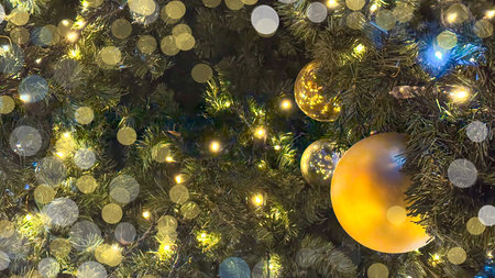 Christmas Background With Golden Christmas Baubles Hanging On Festive Treeの写真素材