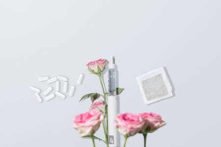 GLP Therapy Concept With Injection Pen, Capsules And Pink Roses On Light Background. Concept of...