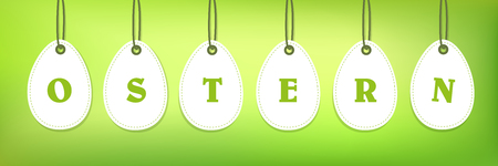 white hanging easter eggs with easter typography isolated on green background vector illustration EPS10のイラスト素材