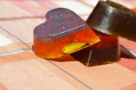 Tree handmade soaps, orange soap heart shape with rose petalの写真素材