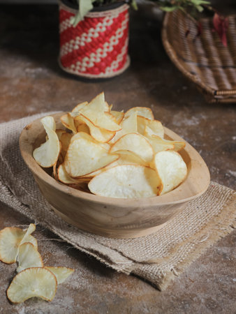 Keripik singkong. Cassava chips or tapioca chips is traditional snack from Java, made of cassava...