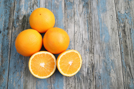 Oranges on wooden tableの写真素材