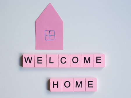Welcome home word wooden cubes on a white backgroundの写真素材