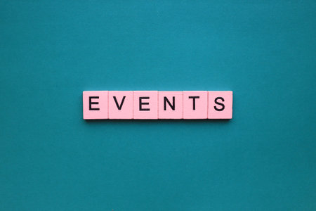 EVENTS text on cubes on a blue background. business concept.の写真素材