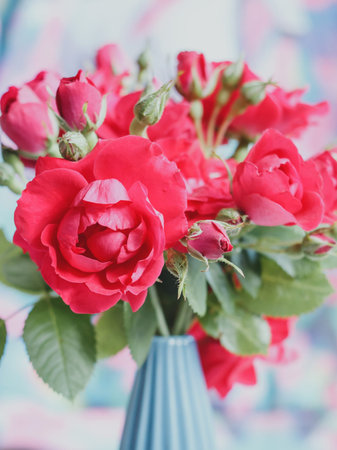 Bouquet of red roses in a blue vase