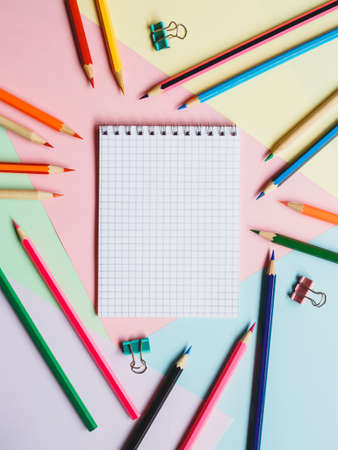 School notebook and pencils, on a multicolored background. Education concept. Back to school.の写真素材