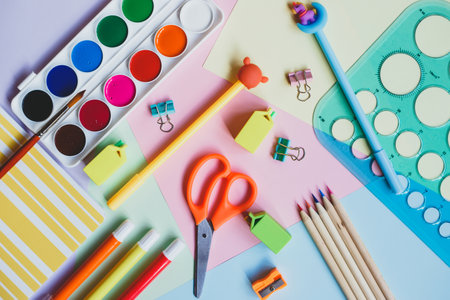 Back to school. School supplies on a multicolored background. Top view.の写真素材