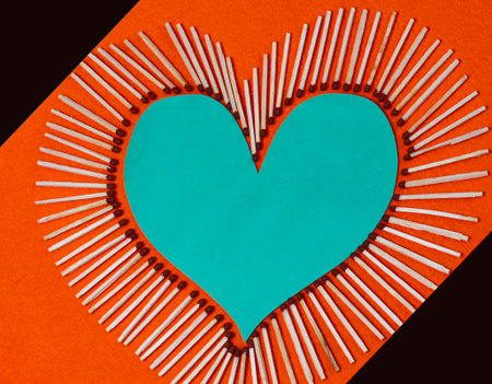 The figure of the heart, lined with not burnt matches. Selective focus, place for text. blue heart...