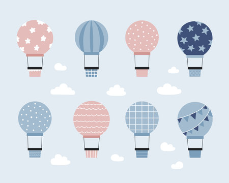 Set of hot air balloons in the sky with clouds. Hand drawn doodle transportation. Vector illustration.のイラスト素材