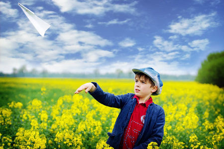 Boy with paper plane