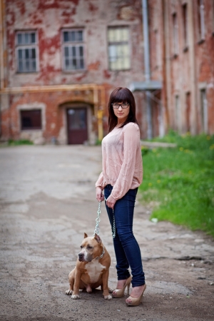 young woman with her dog outdoorsの写真素材