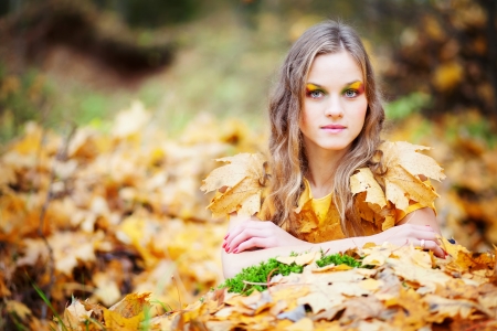 beautiful  girl in the autumn forestの写真素材