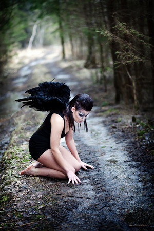 Fantasy image with a fallen angelの写真素材