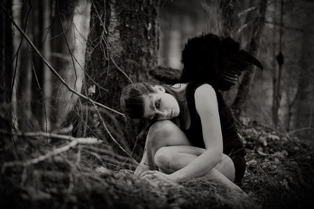 Fantasy image with a fallen angelの写真素材
