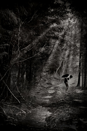 Fantasy image with a fallen angelの写真素材