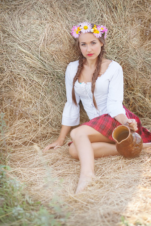 girl with flower wreath outdoorsの写真素材