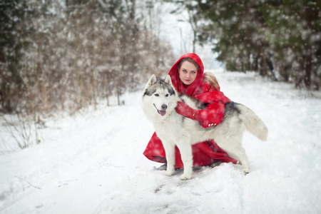 Girl with dog outdoorsの写真素材