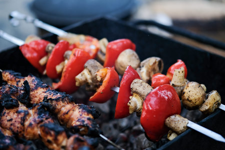 Vegetables fried on coals. Grilled vegetables. Grilled bell pepper. Grilled mushrooms.
