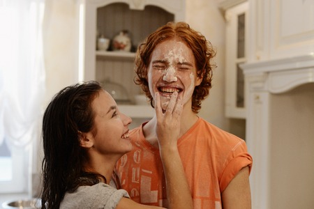 the lovers rejoice and indulge in the beautiful kitchenの写真素材