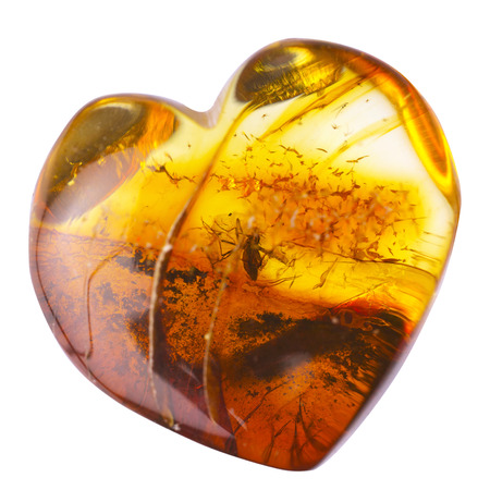 Amber stone inclusion in heart shape.の写真素材
