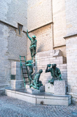 Antwerp, Belgium- July 2, 2019: View of the statue of the Builders of the Cathedral of Our Lady. Monument of Pieter Appelmans in the early morning.のeditorial素材