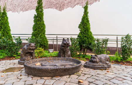 Zelenogradsk, Russia - September 22, 2018: View of sculptural composition - Kotofeynya. Three cats sitting by a bowl of fish.のeditorial素材