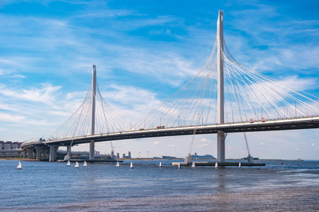 Saint Petersburg, Russia - June 19, 2019: The cable-stayed bridge is the part of Western High-Speed Diameter of the road of Saint Petersburg. View of the construction with floating small yachts.のeditorial素材